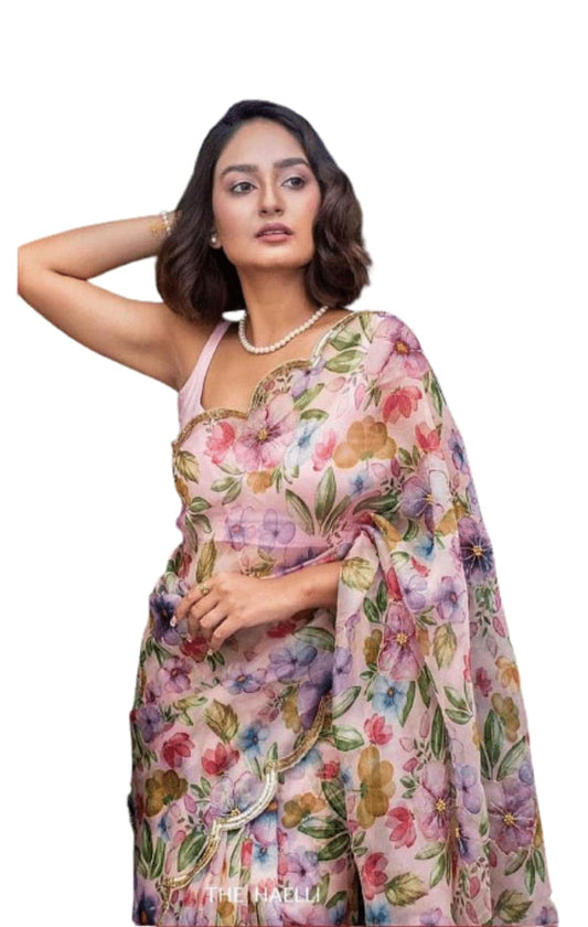 Embellished net saree with sequin work, adding a glamorous and stylish appeal.