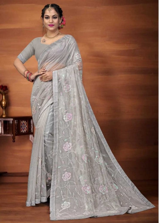 Lightweight Banarasi tissue silk saree with a grand woven pallu, ideal for weddings.